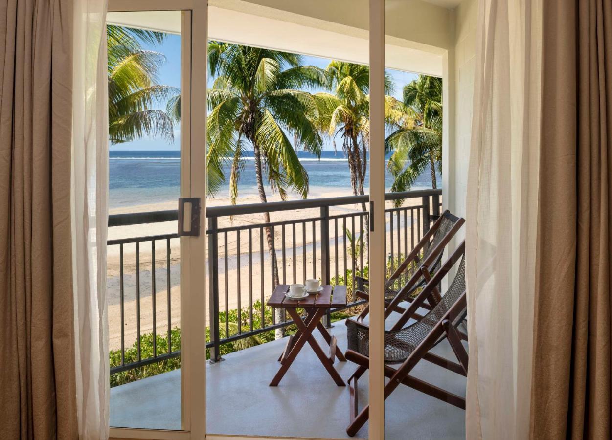 Outrigger Fiji Beach Resort Korotogo Exterior photo A view of the beach from a room at the resort